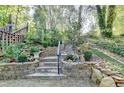 Stone steps with landscaping leading to the house and backyard at 8530 Hightower Trl, Snellville, GA 30039