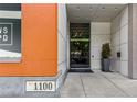 Building entrance with modern architecture, visible address, and accessible entryway with glass doors at 1100 Howell Mill Nw Rd # 711, Atlanta, GA 30318