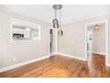 Bright and airy dining room with hardwood floors adjacent to the kitchen at 1910 Thompson Ave, East Point, GA 30344