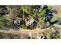 Aerial view of a property with a defined lot line, showcasing a beautiful home and a swimming pool in the backyard at 4777 Ardmore Ln, Hoschton, GA 30548