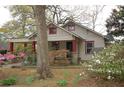 Charming home with a covered porch, well-maintained landscaping, and inviting curb appeal at 1130 Ridge Ave, Stone Mountain, GA 30083