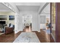 Inviting foyer with hardwood floors, high ceilings, and a view into the living spaces at 1665 Millhouse Lndg, Marietta, GA 30066