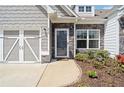 Close up of house exterior with stylish front door and a well manicured landscaped flower bed at 510 Riverview Ln, Canton, GA 30114