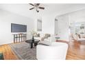 Spacious living room with hardwood floors, a modern fireplace, and open layout perfect for entertaining and relaxation at 218 Ridley Ln, Decatur, GA 30030