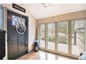 Foyer featuring ample natural light from large windows and a decorative front door at 3341 Camelot Way, Loganville, GA 30052