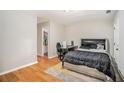 Comfortable bedroom with hardwood floors and door leading to walk in closet at 3956 Church View Ln, Suwanee, GA 30024