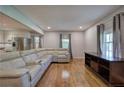 Bright living room with hardwood floors, large window, and comfortable seating at 4361 Stanley Dr, Powder Springs, GA 30127