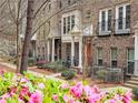A vibrant display of pink azaleas and lush greenery enhance the townhome community's curb appeal at 2168 Rock Creek Park, Decatur, GA 30033