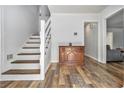 Bright foyer with hardwood floors and staircase at 1757 Colonial South Sw Dr, Conyers, GA 30094