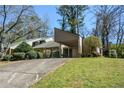 Charming single-story home featuring a covered carport and mature landscaping in a nice neighborhood at 154 Weatherly Way, Alpharetta, GA 30009