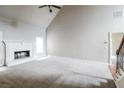 Spacious living room features a fireplace, neutral carpet, and light gray walls at 1209 Richmond Rdg, Loganville, GA 30052
