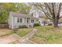 Inviting one-story home with a lush front lawn and cozy, well-maintained landscaping at 2460 Constance St, East Point, GA 30344