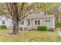 Cozy single-level home with manicured lawn and an inviting facade, perfect for a small Gathering at 2460 Constance St, East Point, GA 30344