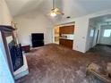 Cozy living room showcasing a fireplace, seamlessly connected to the kitchen, great for entertaining at 204 Appalachee Church Rd, Auburn, GA 30011