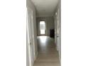 Bright hallway with hardwood floors and white doors at 3695 Church St, Clarkston, GA 30021