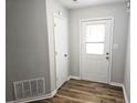 Entryway features gray walls, white trim, wood floor, and white door at 4093 Chapel Mill Bnd, Decatur, GA 30034