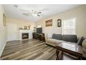 Cozy living room with fireplace and laminate flooring provides comfortable atmosphere at 792 Russell Dr, Riverdale, GA 30296