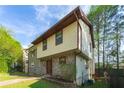 Charming two-story home features a unique stone facade and neutral siding, creating a cozy curb appeal at 1248 Falling Water Se Dr, Smyrna, GA 30080