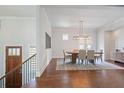 Bright dining room showcasing hardwood floors, a modern light fixture, and ample space for entertaining at 3080 Dickson Ne St, Brookhaven, GA 30319