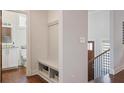 Mudroom features bench, storage baskets, coat hooks and leads to a half-bathroom at 3080 Dickson Ne St, Brookhaven, GA 30319