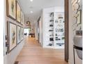 Elegant entryway with hardwood floors, built-in shelving, and stylish decor, creating a welcoming atmosphere at 2940 W Village Dr # 60, Suwanee, GA 30024