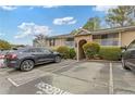 Condo exterior featuring manicured bushes, stone entryway, reserved parking and balcony at 3155 Seven Pines Ct # 303, Atlanta, GA 30339