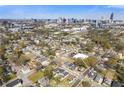Aerial view of the neighborhood with the city skyline in the distance and a detailed view of the property at 459 James P Brawley Nw Dr, Atlanta, GA 30318
