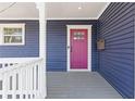 Inviting front entrance with a colorful door, white trim, and classic architectural details at 459 James P Brawley Nw Dr, Atlanta, GA 30318