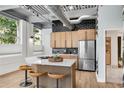Modern kitchen featuring stainless steel appliances, island with seating, and stylish backsplash at 400 Village Ne Pkwy # 203, Atlanta, GA 30306