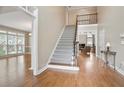 Grand foyer showcasing hardwood floors, a staircase, and an open layout to the living spaces at 4093 Tritt Homestead Dr, Marietta, GA 30062
