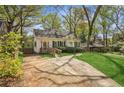 Inviting home with a well-kept lawn and a convenient driveway that leads to ample parking at 28 Exeter Rd, Avondale Estates, GA 30002