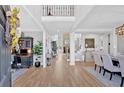 Spacious foyer with hardwood floors and neutral decor, leading to various living spaces, and staircase at 3509 Ivy Manor Se Rd, Smyrna, GA 30080