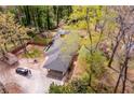 Drone image displays the house, spacious driveway, shed, and car port at 1714 Highland Pl, Decatur, GA 30035
