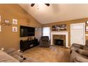 Comfortable living room featuring a stone fireplace and ample seating for relaxation at 20 Riverbrooke Rd, Covington, GA 30016