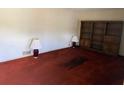 Living room featuring built-in shelving, neutral wall color, and wall to wall carpeting at 4172 N Martin Way, Lithia Springs, GA 30122