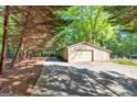 Ranch-style house with attached garage, long drive, and mature trees offering lots of shade at 2701 East Mill Sw Way, Conyers, GA 30094