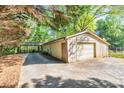 View of the home's detached garage and carport, providing ample parking space at 2701 East Mill Sw Way, Conyers, GA 30094