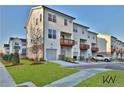 Modern townhomes with attached garages and well-maintained landscaping at 3764 Sage Park Way, Suwanee, GA 30024