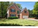 Charming two-story brick home with a well-manicured lawn, and attached two car garage at 3225 Warren Creek Sw Dr, Hiram, GA 30141