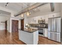 Modern kitchen with stainless steel appliances, granite countertops, and a stylish island at 172 Haynes Sw St # 108, Atlanta, GA 30313