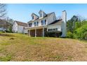 Exterior showcasing the home's design, landscaping, and surrounding greenery at 3267 Forrest Bluff Way, Lithonia, GA 30038