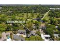 Aerial view of property highlighting its proximity to Ansley Golf Club and lush green surroundings at 219 Little John Trail NE at 219 Little John Ne Trl, Atlanta, GA 30309