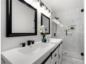 Stylish bathroom featuring double vanity and glass-enclosed shower at 2277 Cloverdale Se Dr, Atlanta, GA 30316