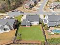 Aerial view of the property showcasing the spacious backyard, pool, and surrounding neighborhood at 240 Brookwood Estates Dr, Alpharetta, GA 30005