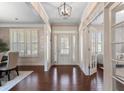 Inviting foyer with hardwood floors, natural light, and elegant details at 240 Brookwood Estates Dr, Alpharetta, GA 30005
