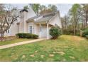 Charming home exterior with a well-kept lawn, lovely shrubbery, and a cozy, covered entryway at 6502 Wellington Chase Ct, Lithonia, GA 30058