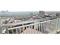 Enjoy the cityscape from this balcony view, showcasing urban skyline and lush green treetops at 3338 Peachtree Ne Rd # 2701, Atlanta, GA 30326
