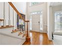 Welcoming foyer with hardwood floors, natural light, and view of the front door at 3395 Hunters Place, Stonecrest, GA 30038