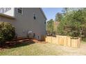 Exterior side yard shows lush lawn with privacy fence at 1924 Sweet Flag Rd, Lawrenceville, GA 30045