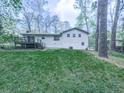This home features a spacious backyard with a deck, perfect for outdoor living and entertaining at 1090 Tanglewood Trl, Woodstock, GA 30189